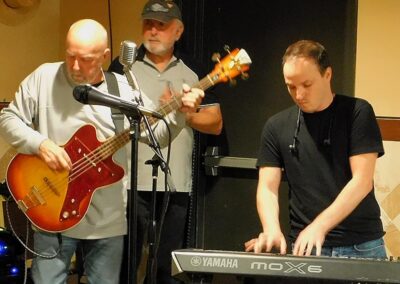 Three men playing instruments