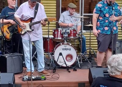 A group of people playing blues music on a patio in Atlanta.
