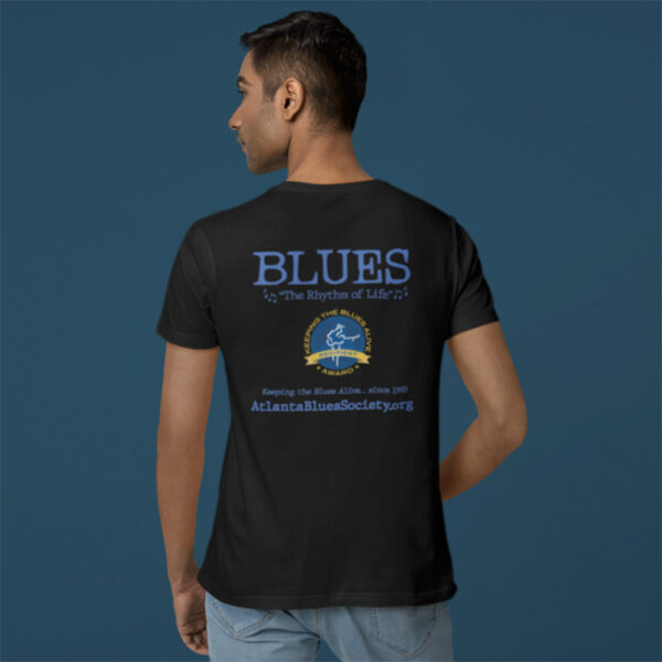 Man wearing a black Georgia Blues T-shirt with a blues music theme and text advertising the Atlanta blues society.