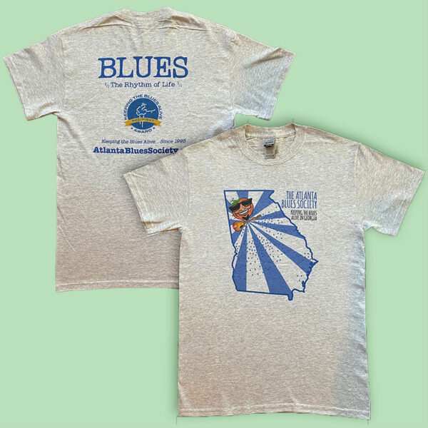 Two t-shirts with atlanta blues society prints, one featuring the text "blues the rhythm of life" and a guitar, and the other with an illustration of a bird playing a guitar over the outline of georgia.