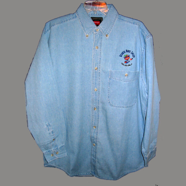 Light blue denim shirt with chest pocket and embroidered logo on a grey background.
