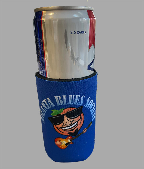 A can of drink is placed inside a blue koozie with "atlanta blues society" and a guitar-playing cartoon character on it.