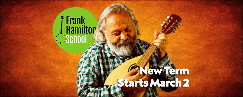 Man playing a string instrument, school announcement.